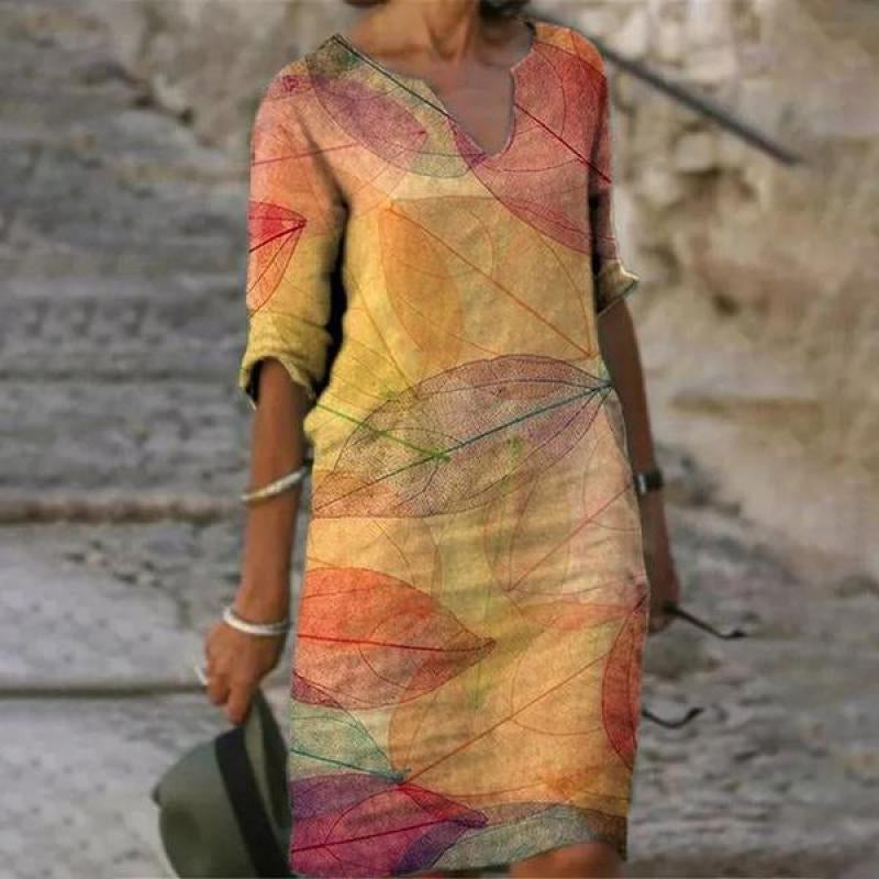Women's printed knee-length shift dress with V-neck and three-quarter sleeves