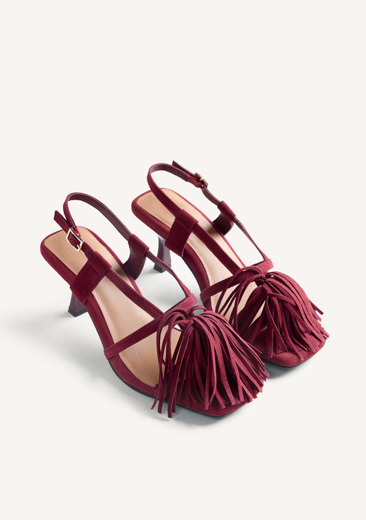Women's burgundy high-heeled sandals with long fringe front and buckle ankle straps