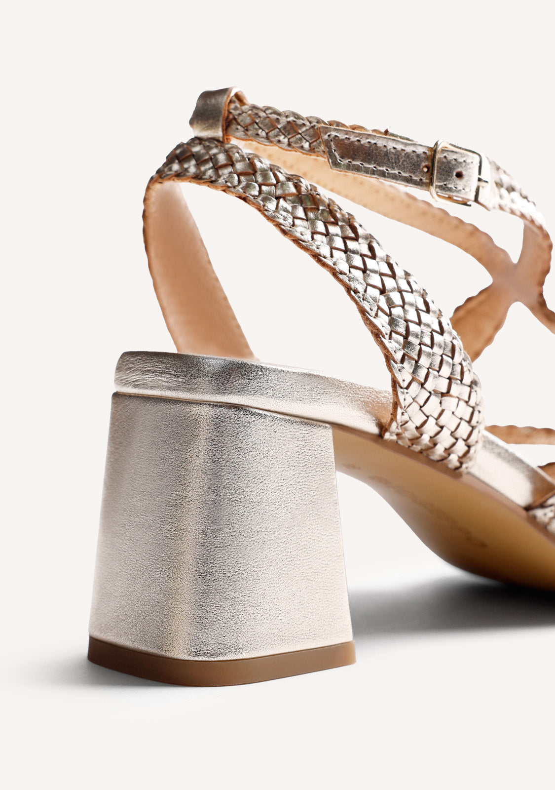 Women's metallic gold woven heeled sandals with ankle buckle straps