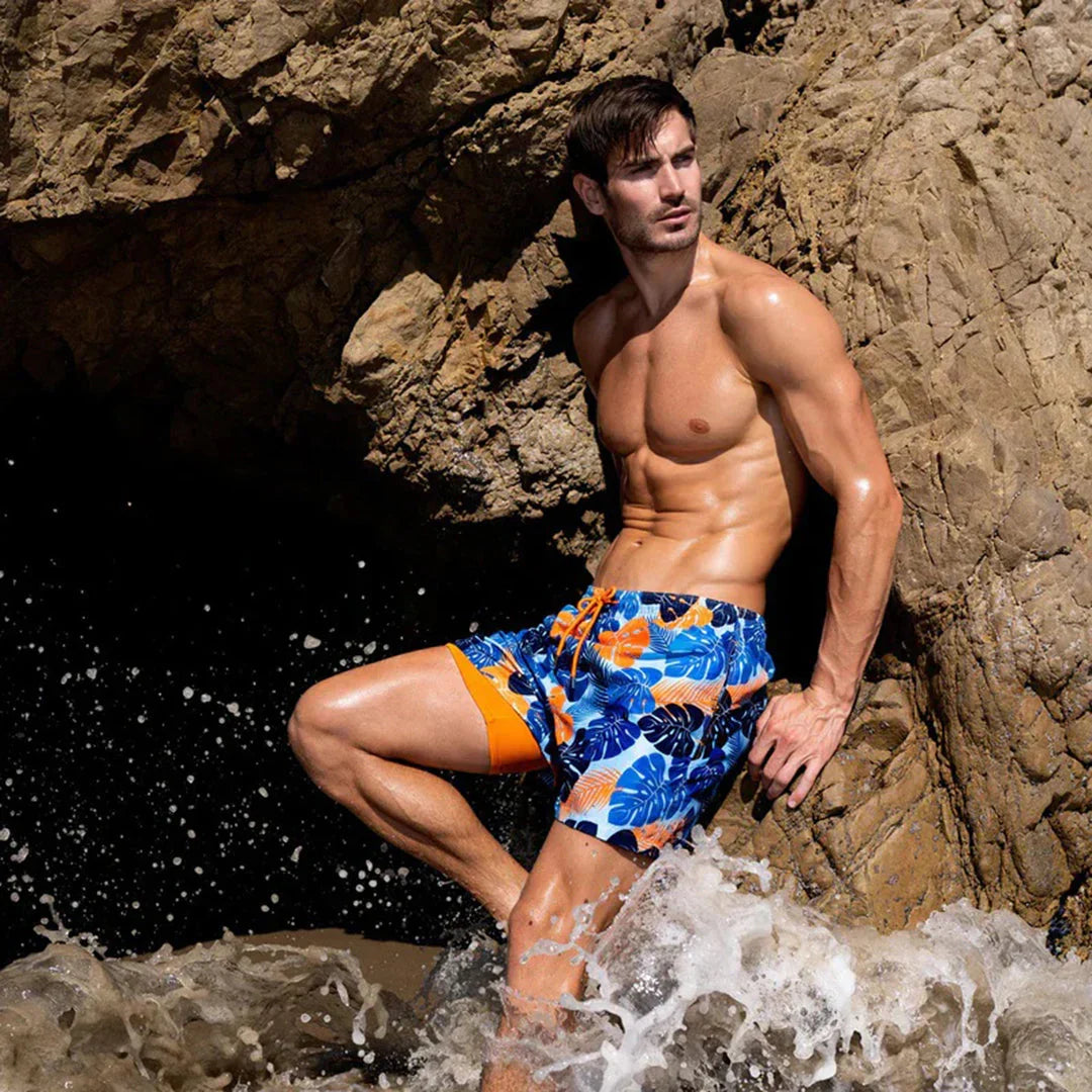 Men's plain mid-length swim shorts with elasticated drawstring waist and side pockets