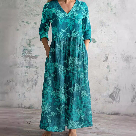 Women's floral V-neck maxi dress with three-quarter sleeves, gathered waist and side pockets