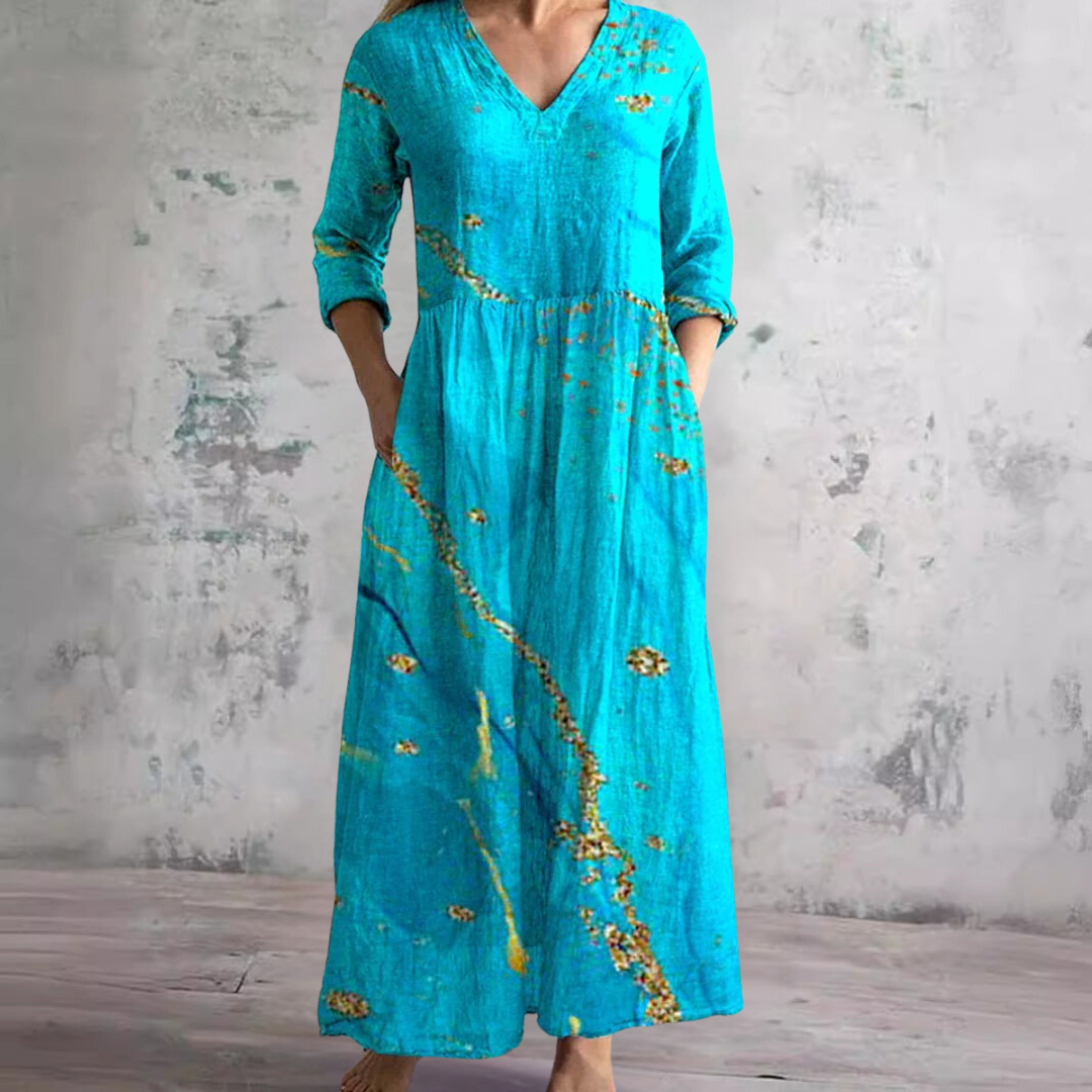 Women's floral V-neck maxi dress with three-quarter sleeves, gathered waist and side pockets