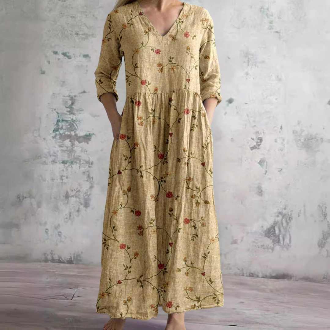 Women's floral V-neck maxi dress with three-quarter sleeves, gathered waist and side pockets