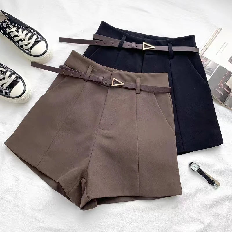 Women's high-waisted tailored shorts with a belt and triangular buckle
