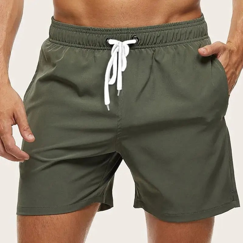 Men's solid swim shorts with elasticated drawstring waist and side pockets
