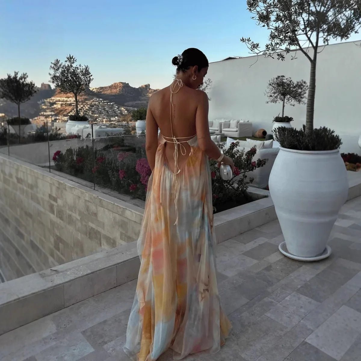 Women's abstract halter maxi dress with flowing sheer overlay and tie back