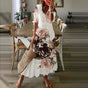 Women's floral bohemian maxi dress with short sleeves and tassel ties
