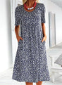 Women's floral midi dress with short sleeves, round neckline and side pockets