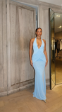 Women's light blue halter maxi dress with plunging neckline and ruched waist