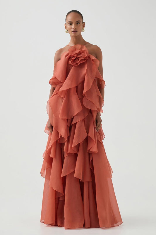 Women's coral sleeveless halter maxi dress with layered ruffles and front flower detail
