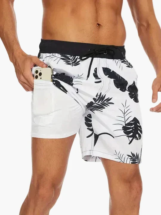 Men's tropical print swim shorts with drawstring waist and inner compression shorts