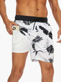 Men's tropical print swim shorts with drawstring waist and inner compression shorts