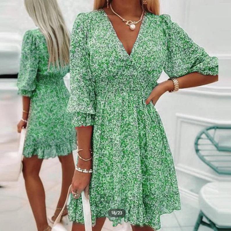 Women's floral V-neck mini dress with 3/4 sleeves and smocked waist