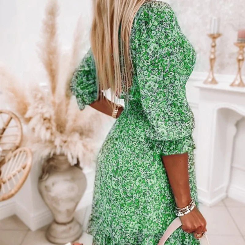 Women's floral V-neck mini dress with 3/4 sleeves and smocked waist