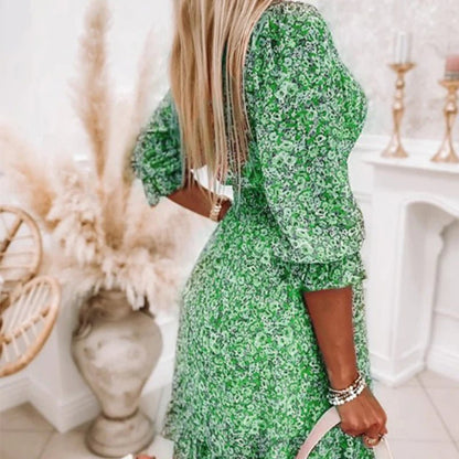 Women's floral V-neck mini dress with 3/4 sleeves and smocked waist