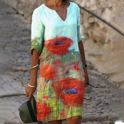 Women's printed knee-length shift dress with V-neck and three-quarter sleeves