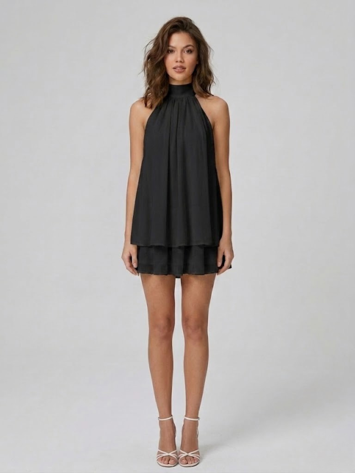 Women's sleeveless halter mini dress with high neck and tiered ruffle hem