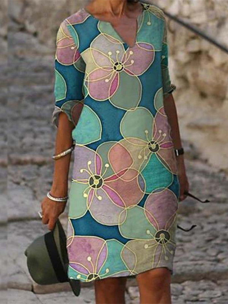 Women's printed knee-length shift dress with V-neck and three-quarter sleeves