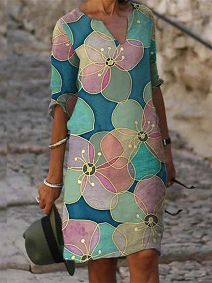 Women's printed knee-length shift dress with V-neck and three-quarter sleeves