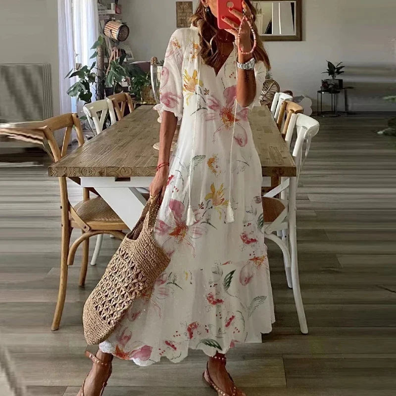Women's floral bohemian maxi dress with short sleeves and tassel ties