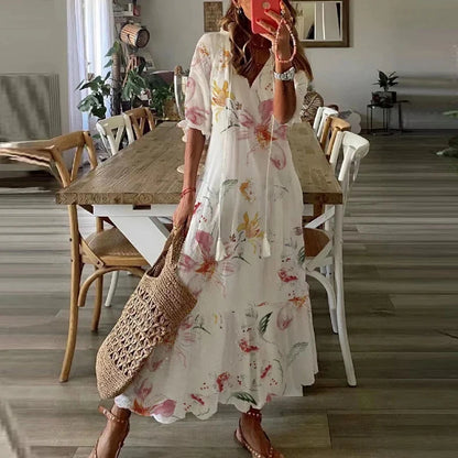 Women's floral bohemian maxi dress with short sleeves and tassel ties