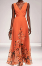 Women's sleeveless floral maxi dress with V-neck wrap bodice and flowing skirt