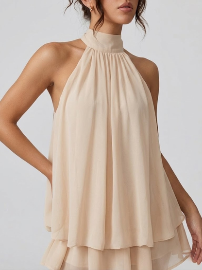 Women's sleeveless halter mini dress with high neck and tiered ruffle hem