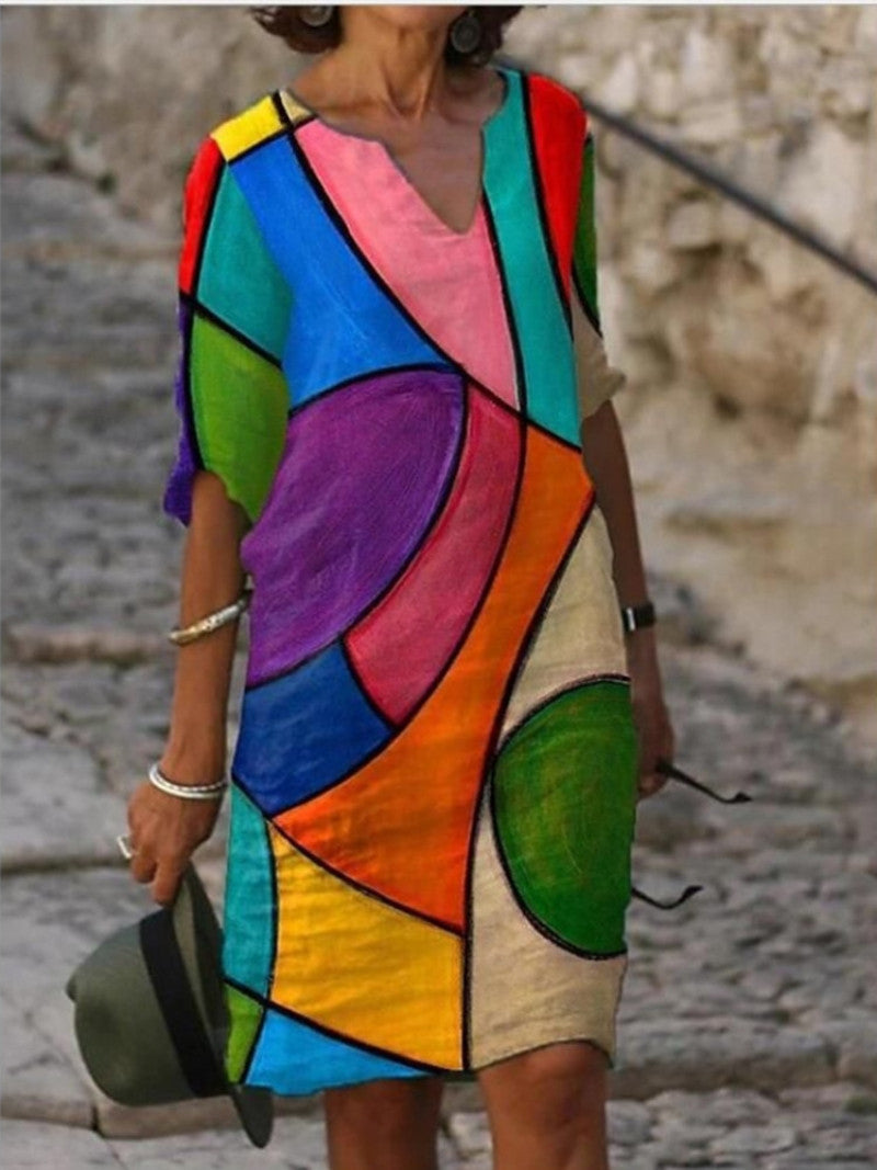 Women's printed knee-length shift dress with V-neck and three-quarter sleeves