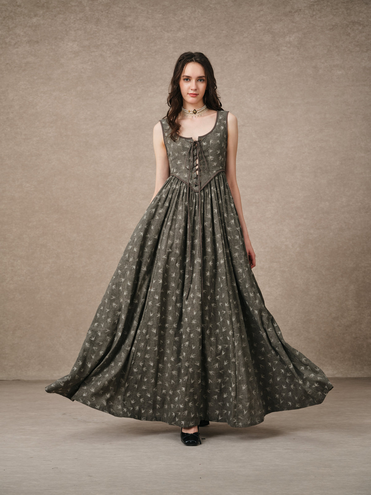 Women's sleeveless lace-up corset maxi dress with a full floral skirt