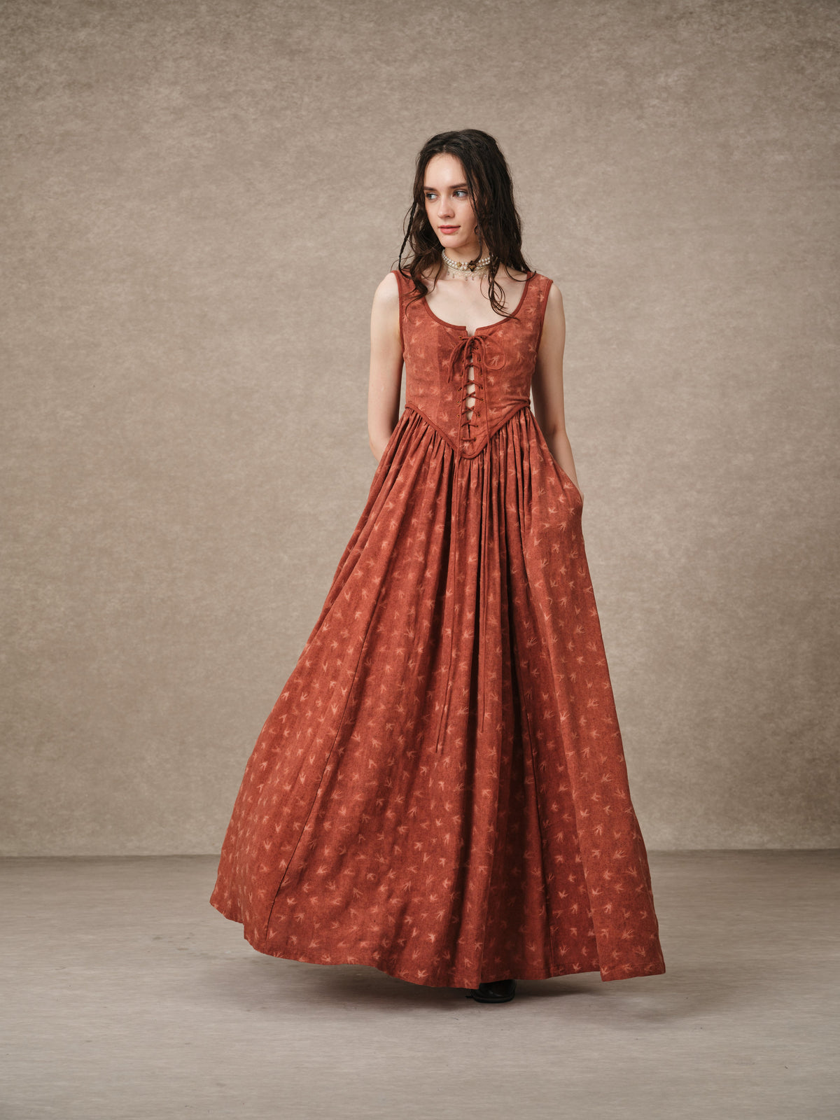 Women's sleeveless lace-up corset maxi dress with a full floral skirt