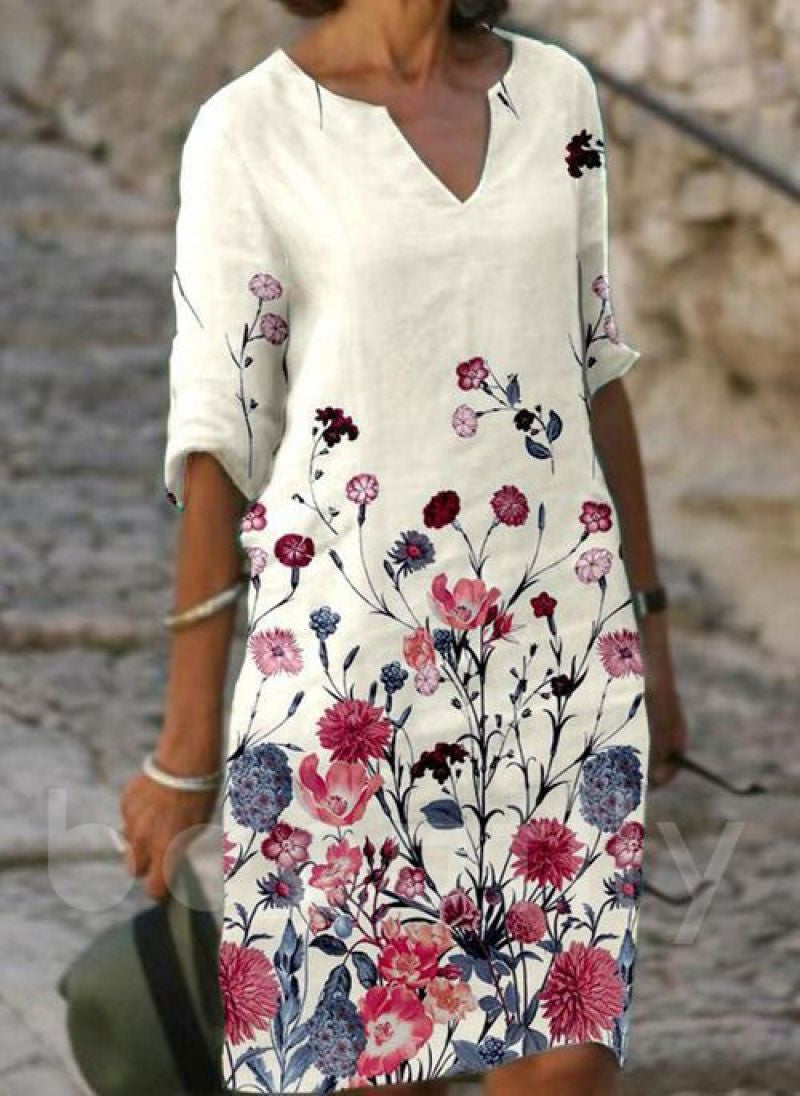 Women's printed knee-length shift dress with V-neck and three-quarter sleeves