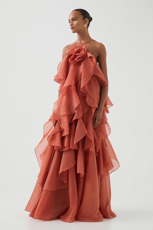 Women's coral sleeveless halter maxi dress with layered ruffles and front flower detail