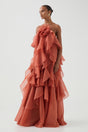 Women's coral sleeveless halter maxi dress with layered ruffles and front flower detail
