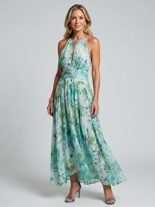 Women's green floral halter maxi dress with pleated waist and flowing skirt