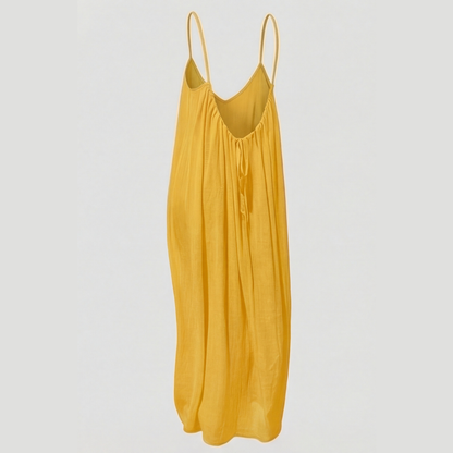 Women's flowing backless maxi dress with V-neckline and spaghetti straps
