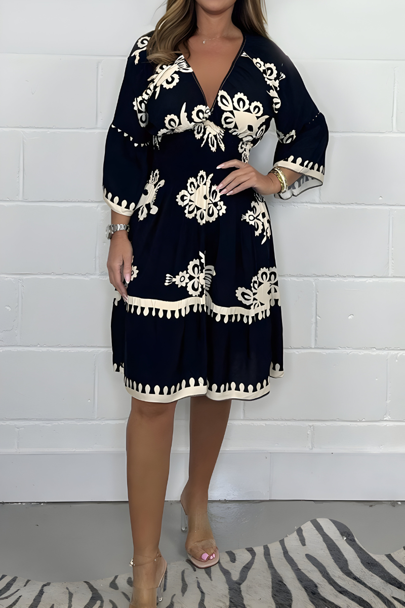 Women's floral boho mini dress with V-neckline and 3/4 sleeves