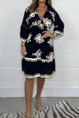 Women's floral boho mini dress with V-neckline and 3/4 sleeves