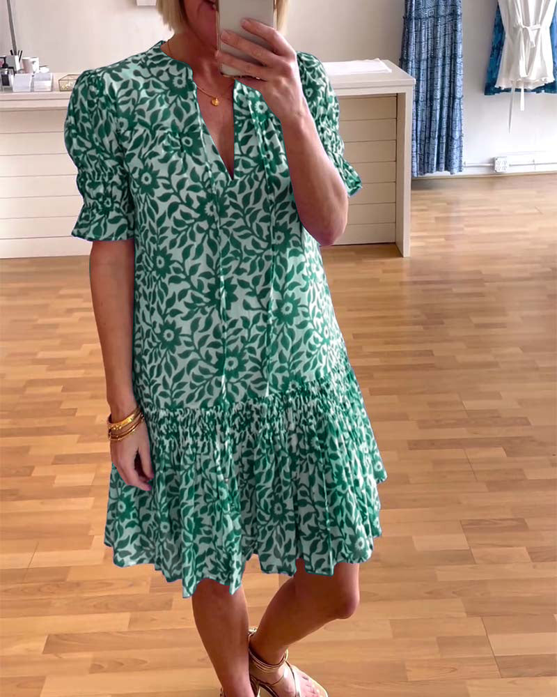 Women's floral mini dress with V-neck, puff sleeves and tiered skirt