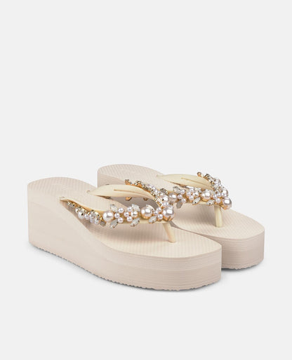 Beige platform flip-flop sandals with pearl embellishment