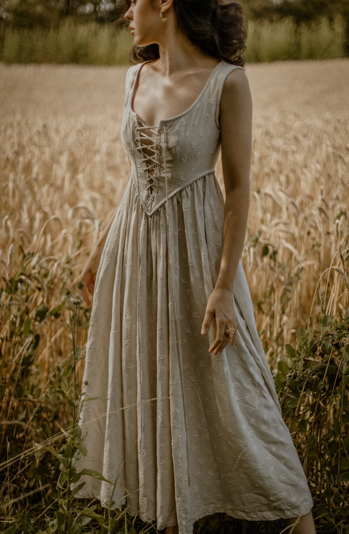 Women's sleeveless lace-up corset maxi dress with a full floral skirt