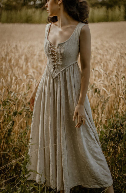 Women's sleeveless lace-up corset maxi dress with a full floral skirt