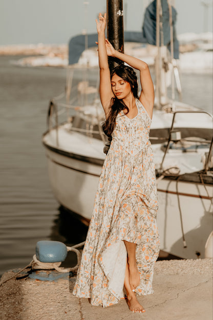 Women's sleeveless lace-up corset maxi dress with a full floral skirt