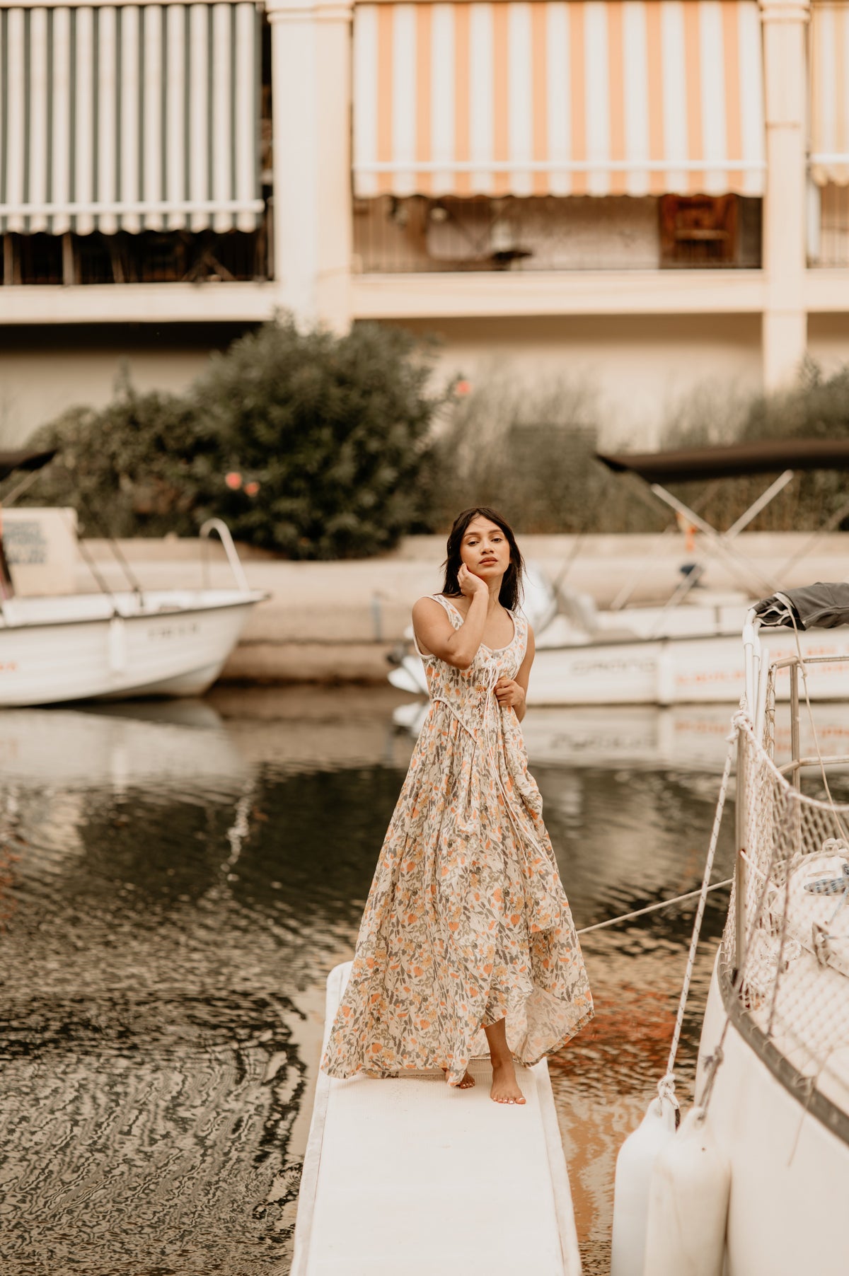 Women's sleeveless lace-up corset maxi dress with a full floral skirt