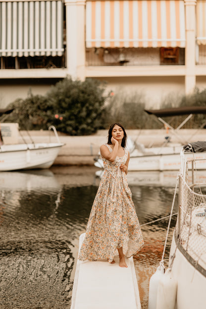 Women's sleeveless lace-up corset maxi dress with a full floral skirt