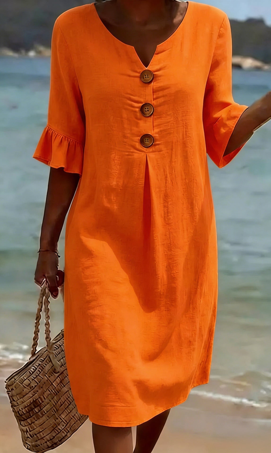 Women's relaxed knee-length button-front dress with split neckline and elbow-length sleeves