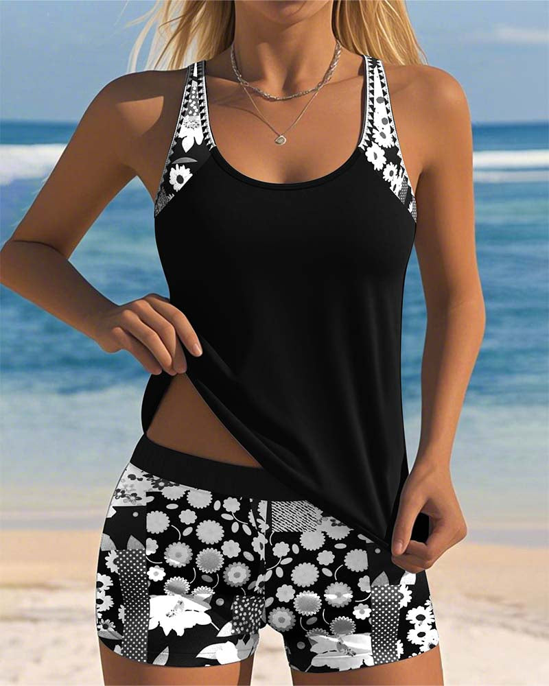 Women's floral tankini swimsuit with sleeveless top and matching shorts