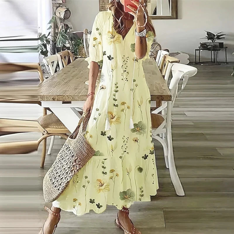 Women's floral bohemian maxi dress with short sleeves and tassel ties