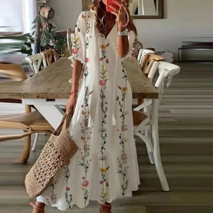 Women's floral bohemian maxi dress with short sleeves and tassel ties