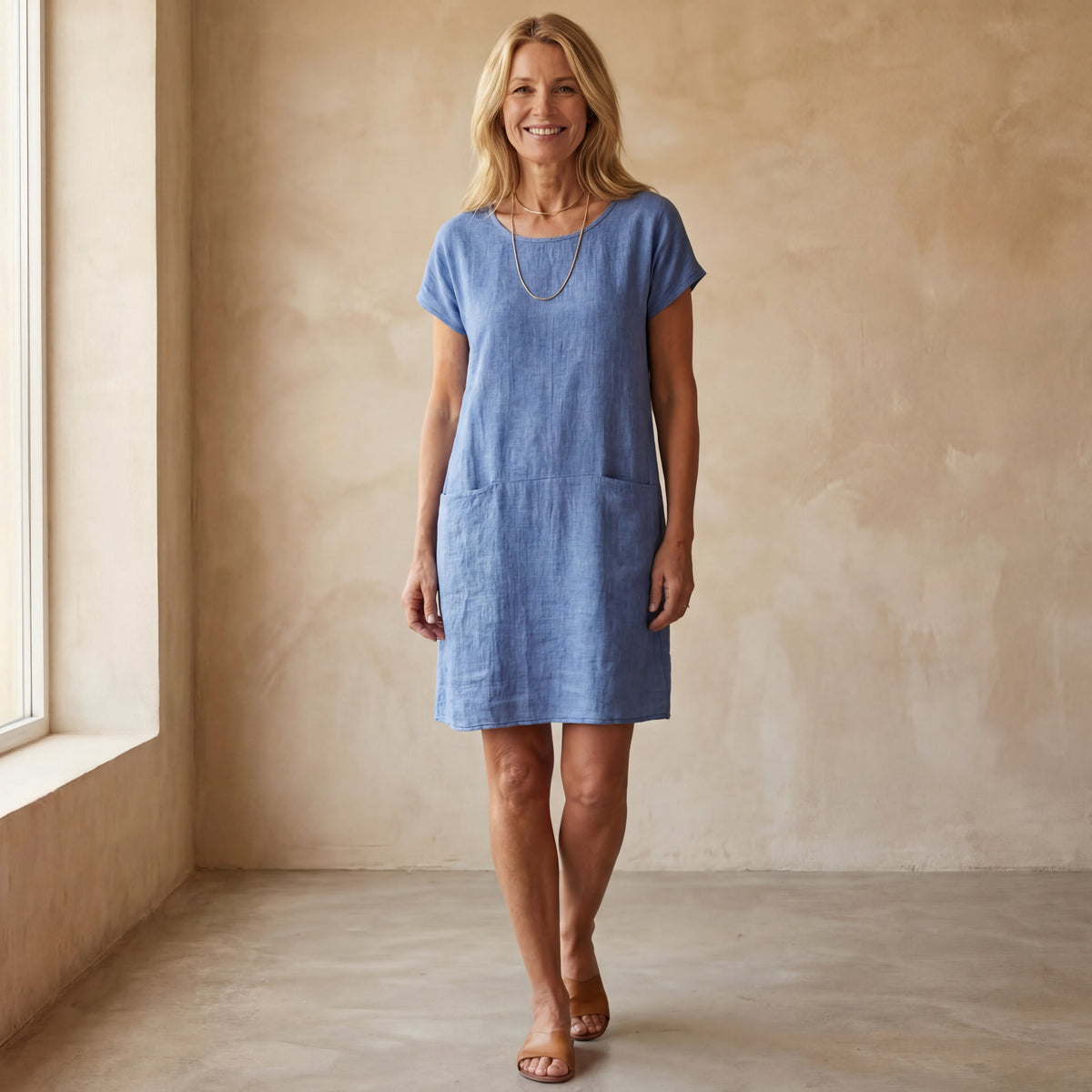 Women's plain short shift dress with round neck, short sleeves and front pockets