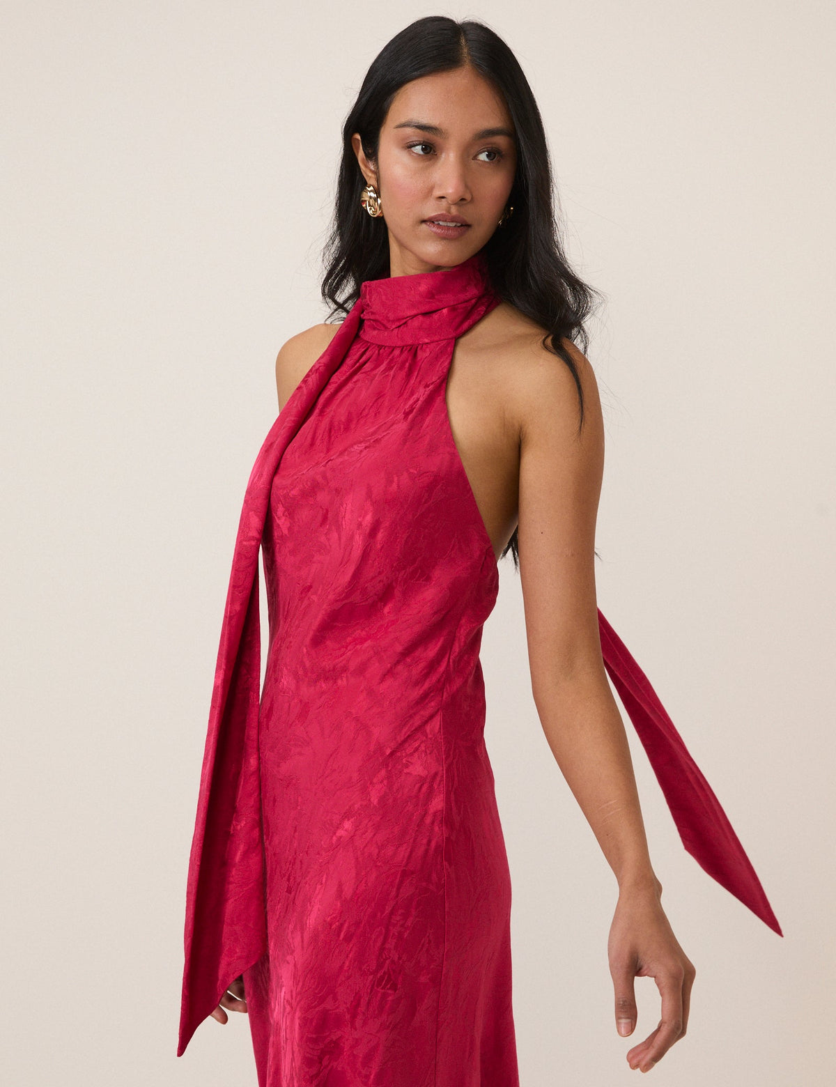 Women's pink sleeveless halter maxi dress with high neck and textured finish